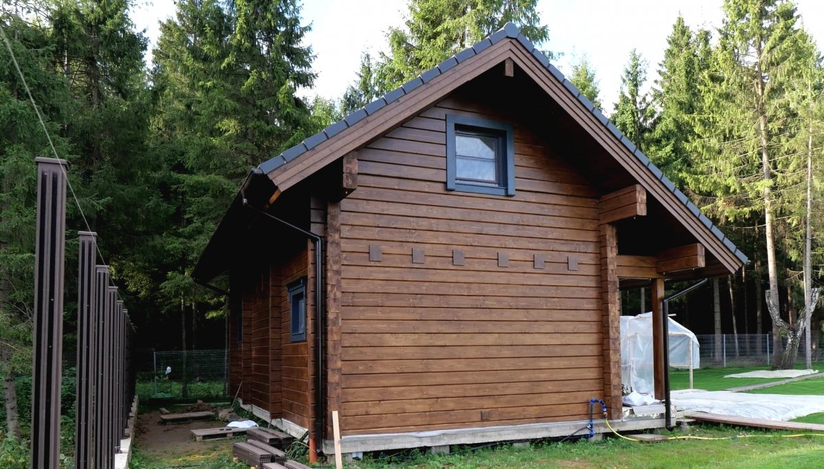 Интересный деревянный дом из бруса - фото 11
