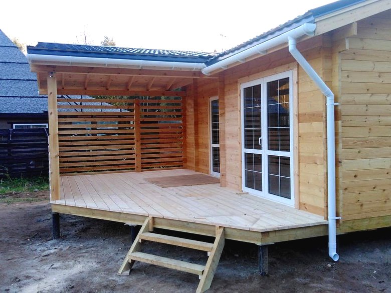 Летний дом из бруса с большой верандой - фото 4